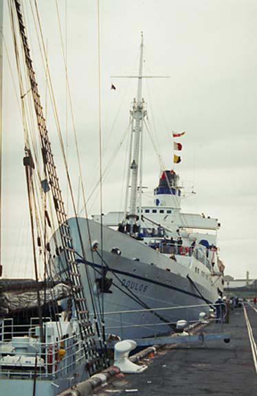 a large boat docked in a small body of water