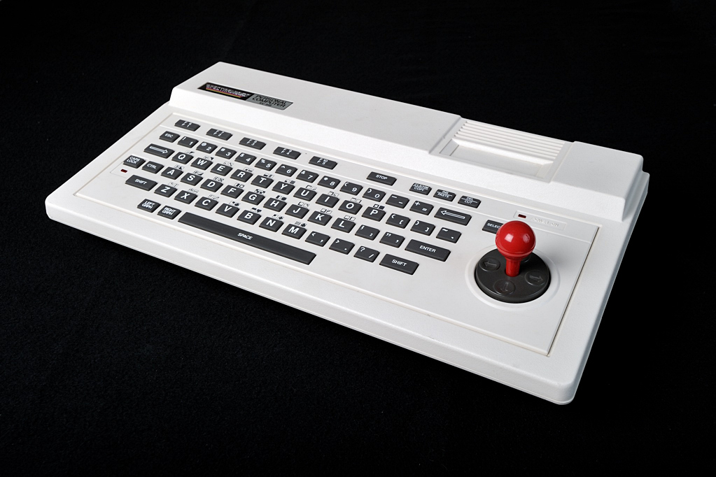 a white computer keyboard with a red mouse