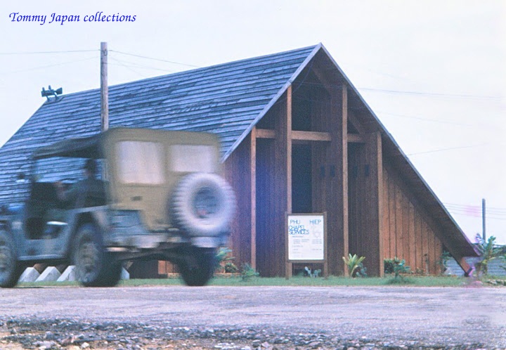 the army truck is approaching a building to deliver supplies