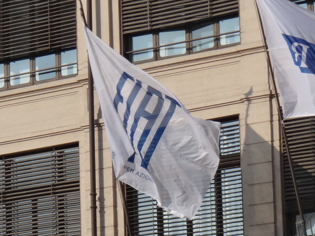 israel and israeli flag waving outside of a large building