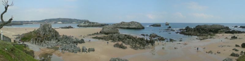 an image of the beach with some rocks in it