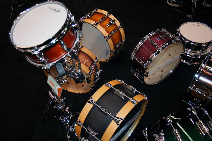 a group of different sized and colorful drums