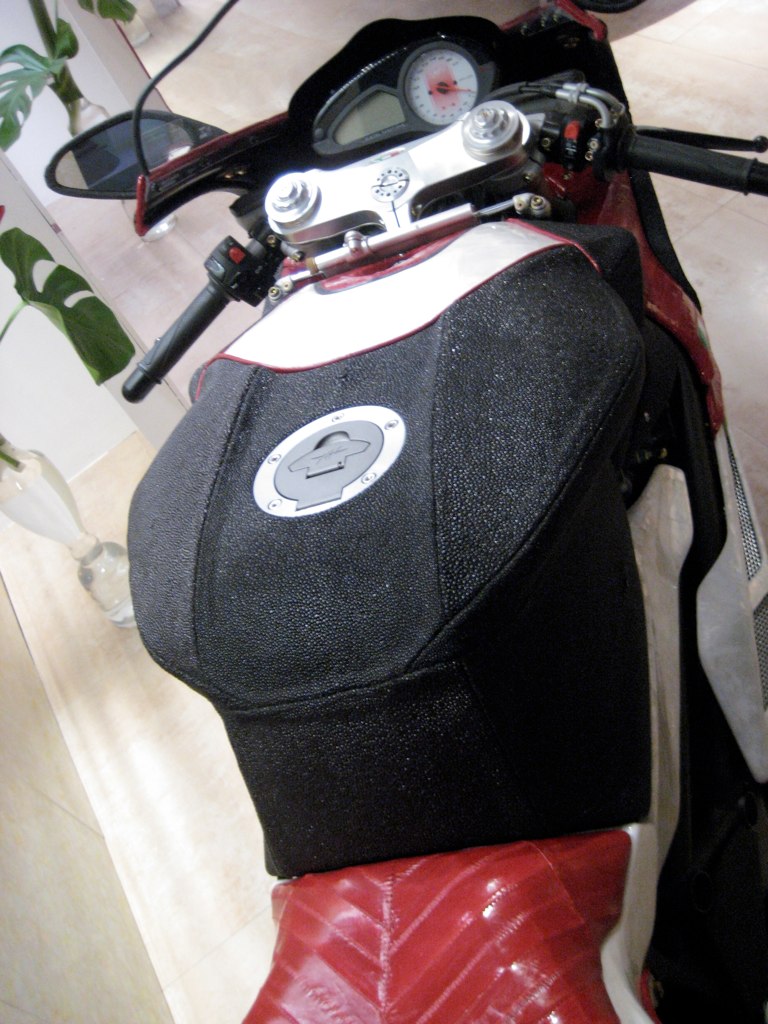 a motorcycle seat cover with patches on it