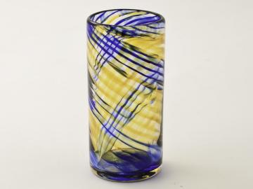 a glass with some black lines and a yellow strip