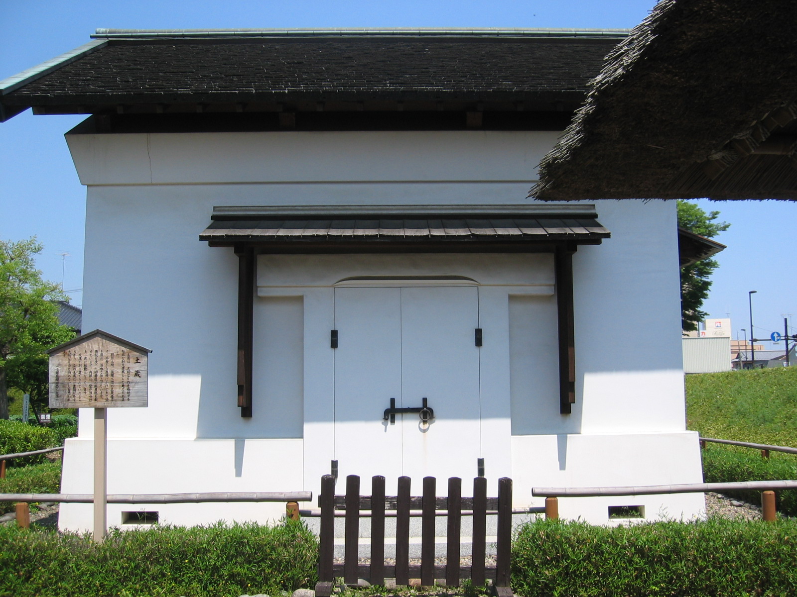 an old style building with a small wooden door