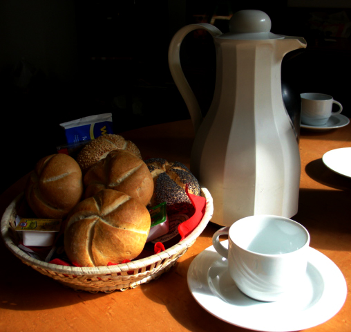 coffee cups on a table and bread basket