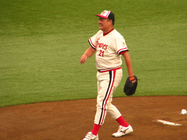 a baseball player walking off the field