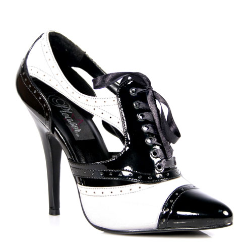a woman wearing high heel shoes with white and black leather