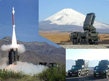 a picture of military vehicles with an army missile