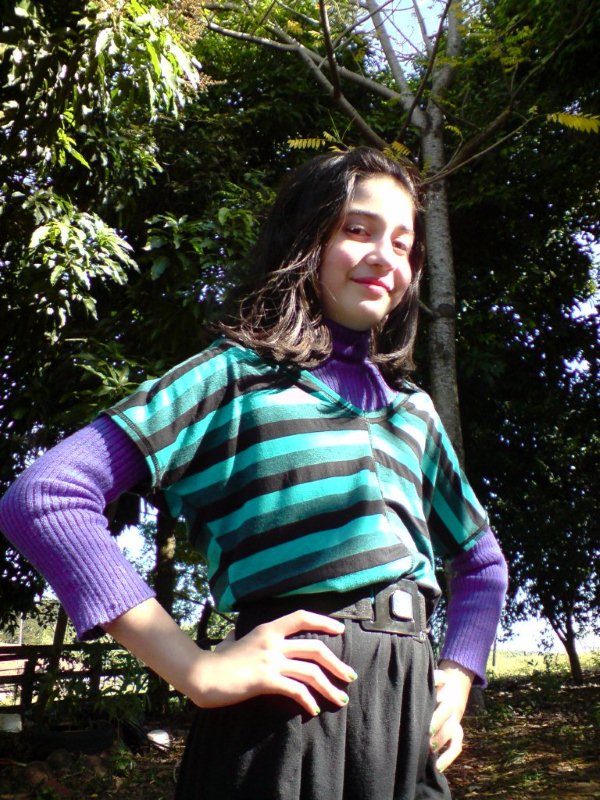 a woman with a short skirt and a striped shirt