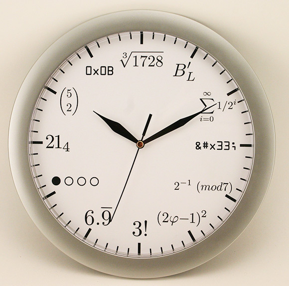an analog wall clock with a time of 9 33