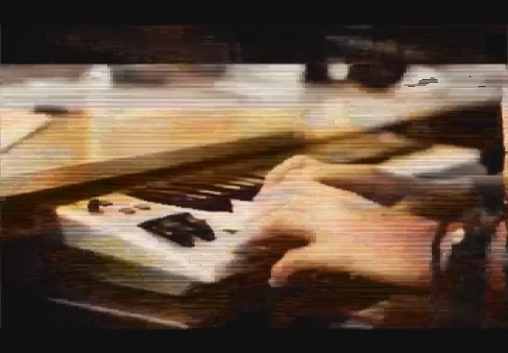 a picture of a hand and piano keyboard
