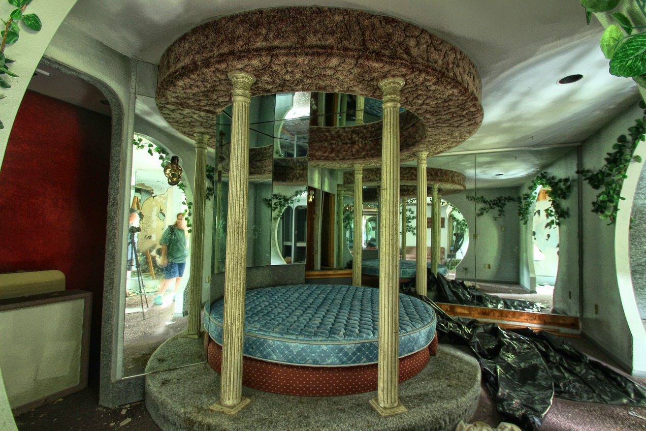 some round room with columns and mattresses inside