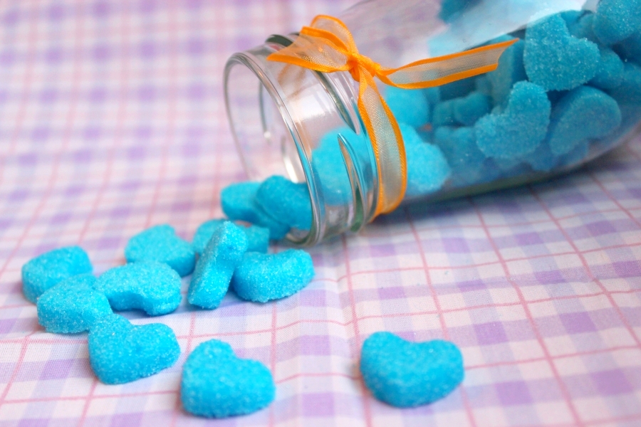 blue little hearts in a jar spilling out of it