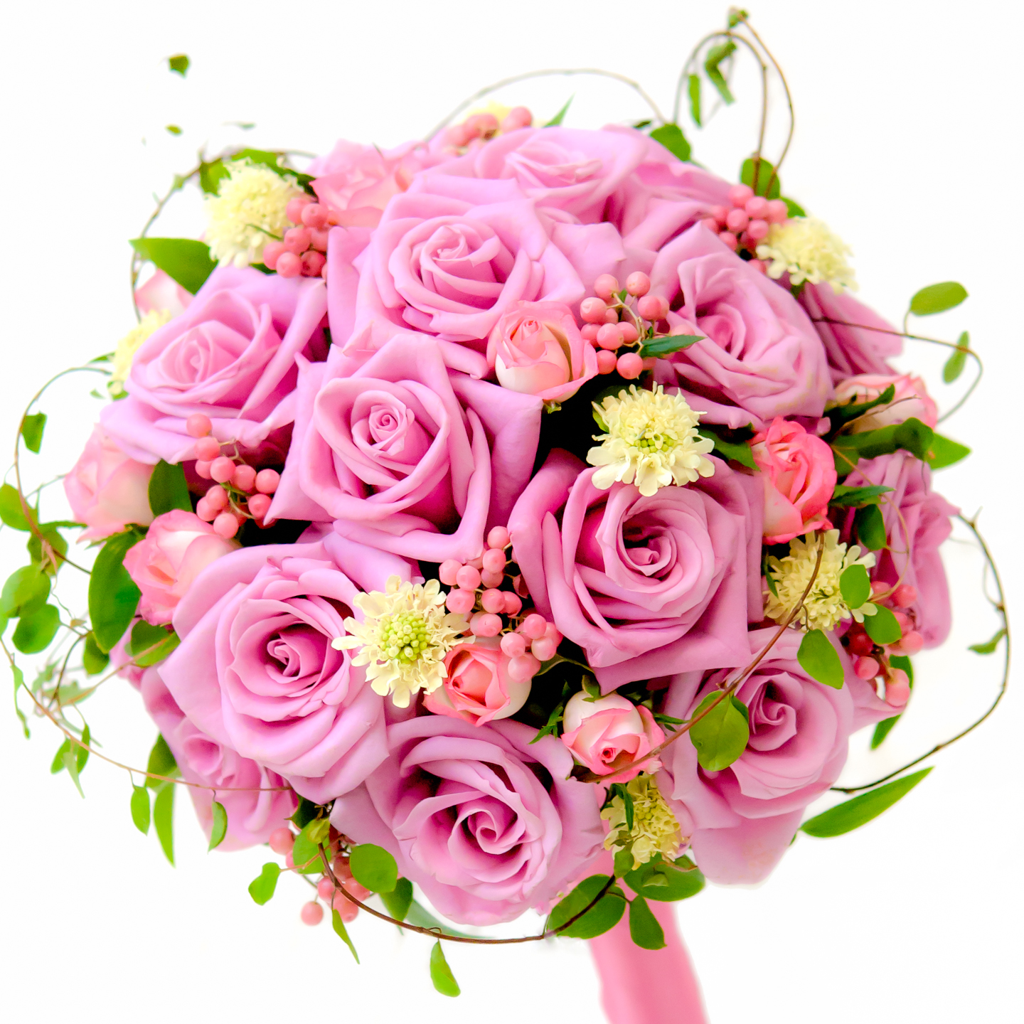 a bouquet of pink roses sits on top of the brides wedding bouquet