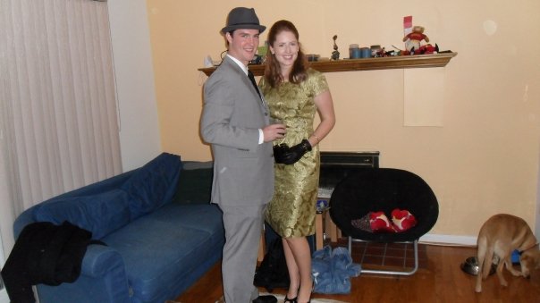 a man and a woman posing in the living room