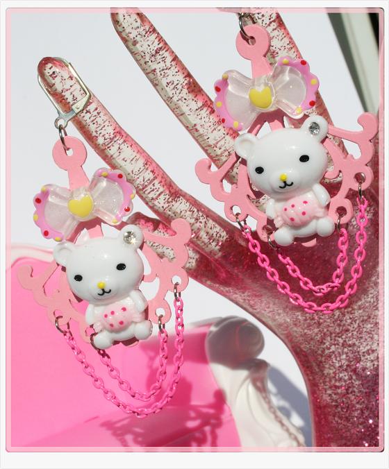 hello kitty hand charms on a pink purse
