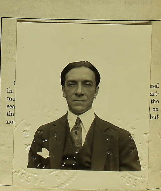 an old picture of a man in a suit and tie