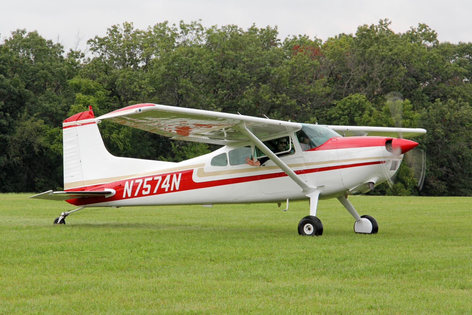a small plane that is sitting in the grass