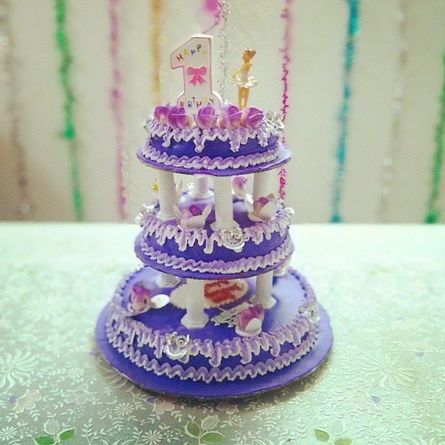 a purple cake with a number on top