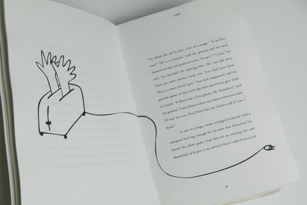 an open book that has a drawing of a hand on it