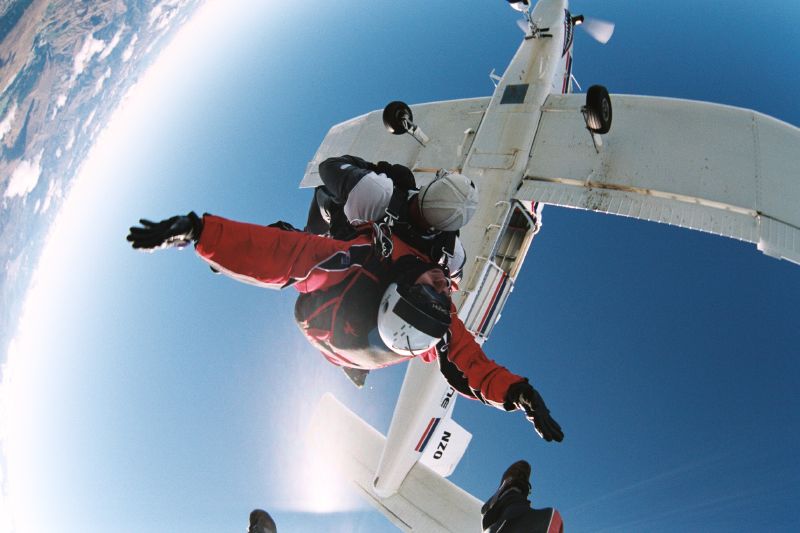 an upside down view of someone sitting on a plane