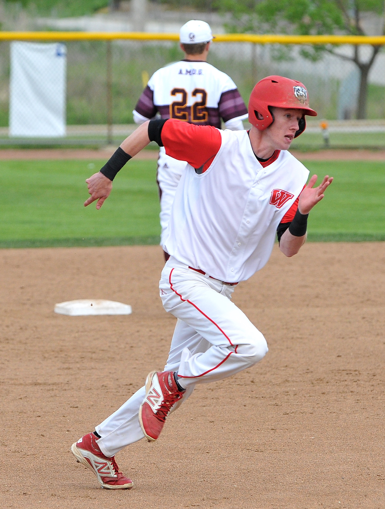 a baseball player on a field with a ball