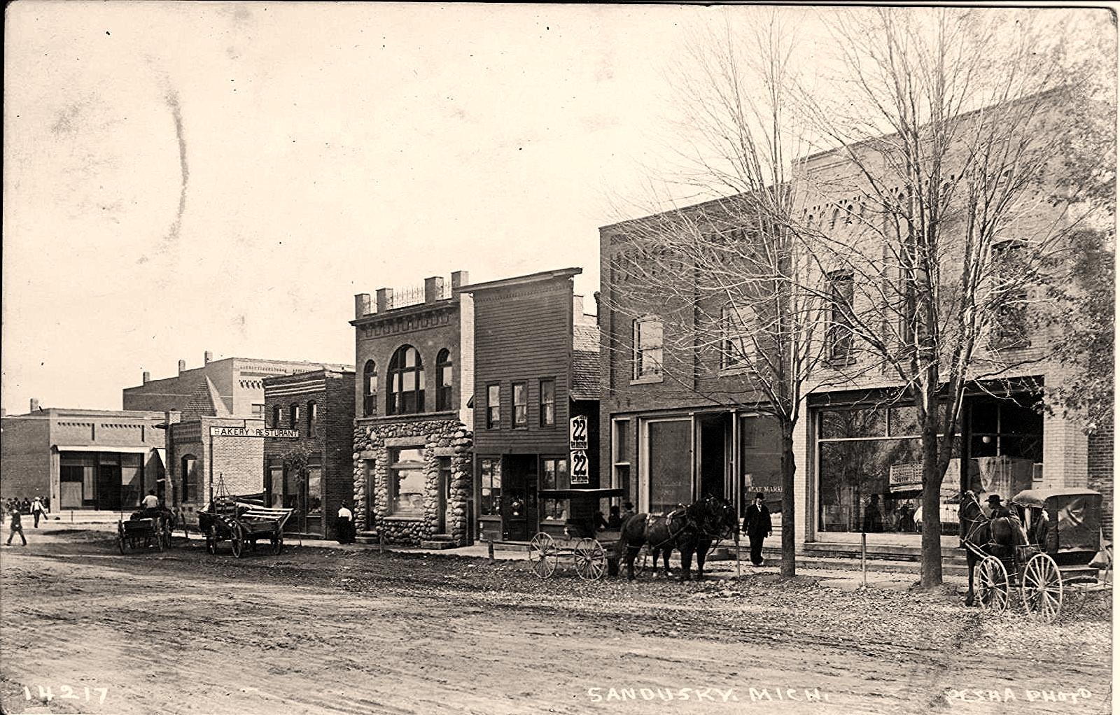 the old fashioned pograph shows horses in front of small buildings