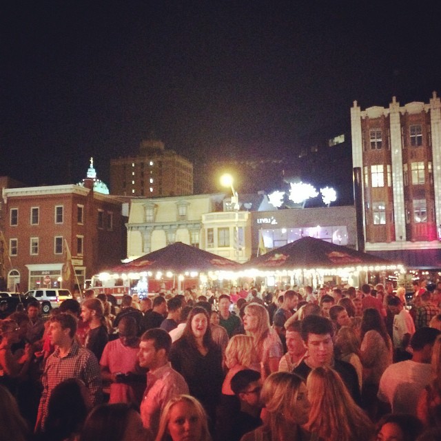 crowded outdoor gathering at night in city square