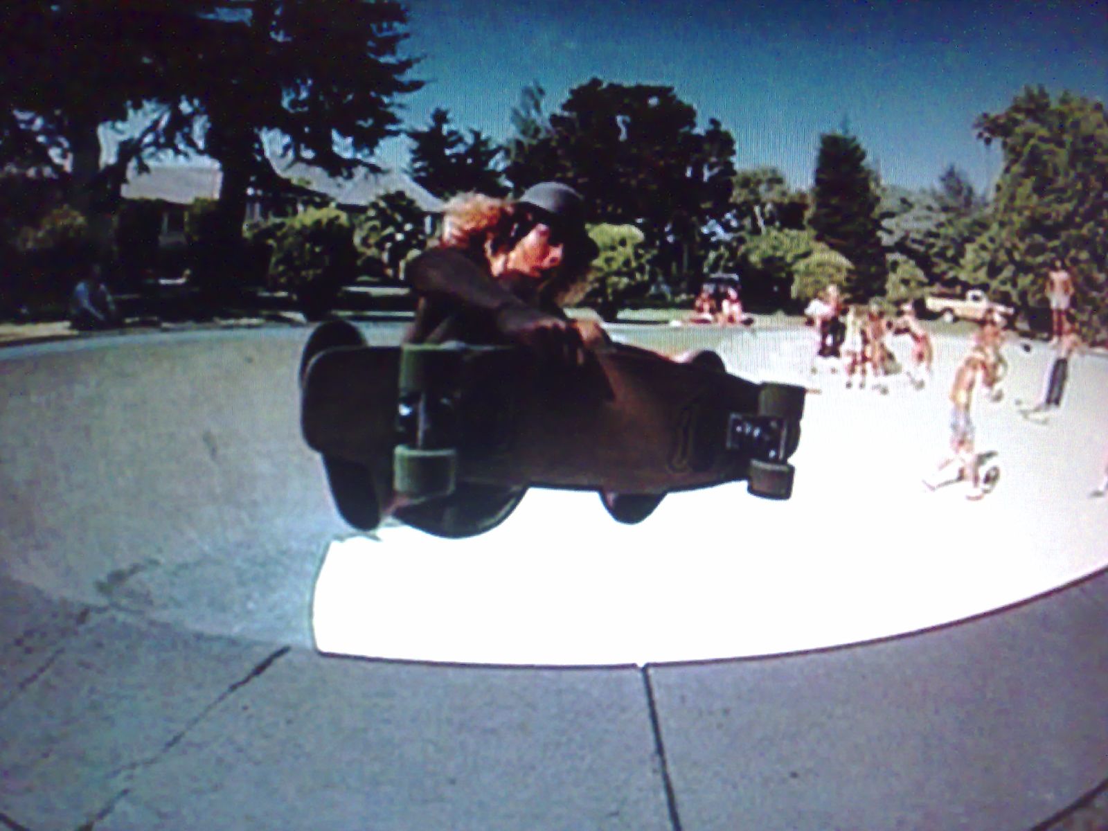 the boy is riding his skateboard through the park