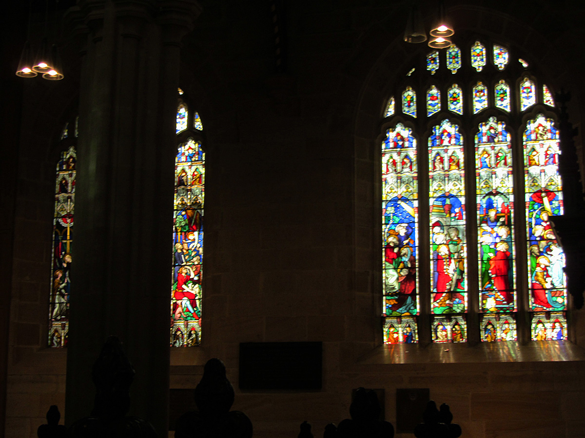 the stained glass window is in the middle of the room