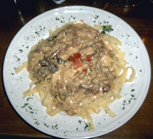 a dish is shown with meat and cheese