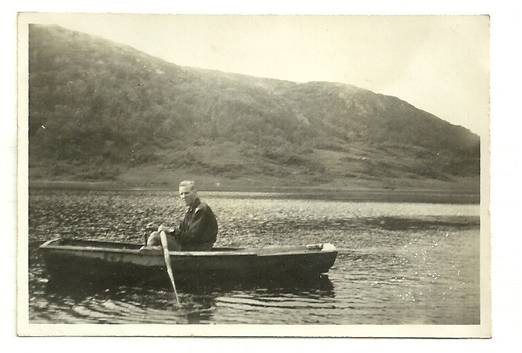 the old man is rowing his canoe in the water