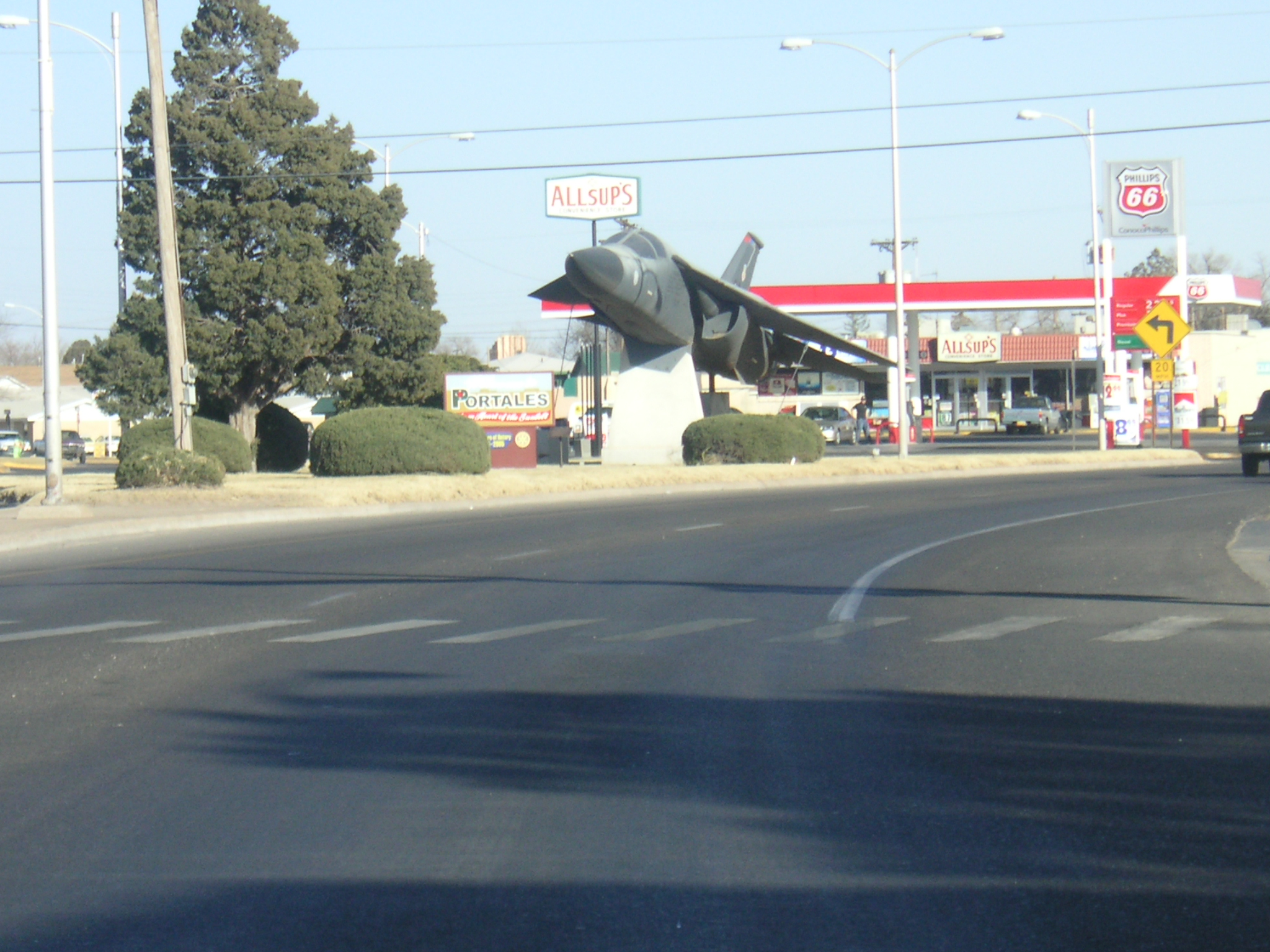 a large airplane on the side of a road