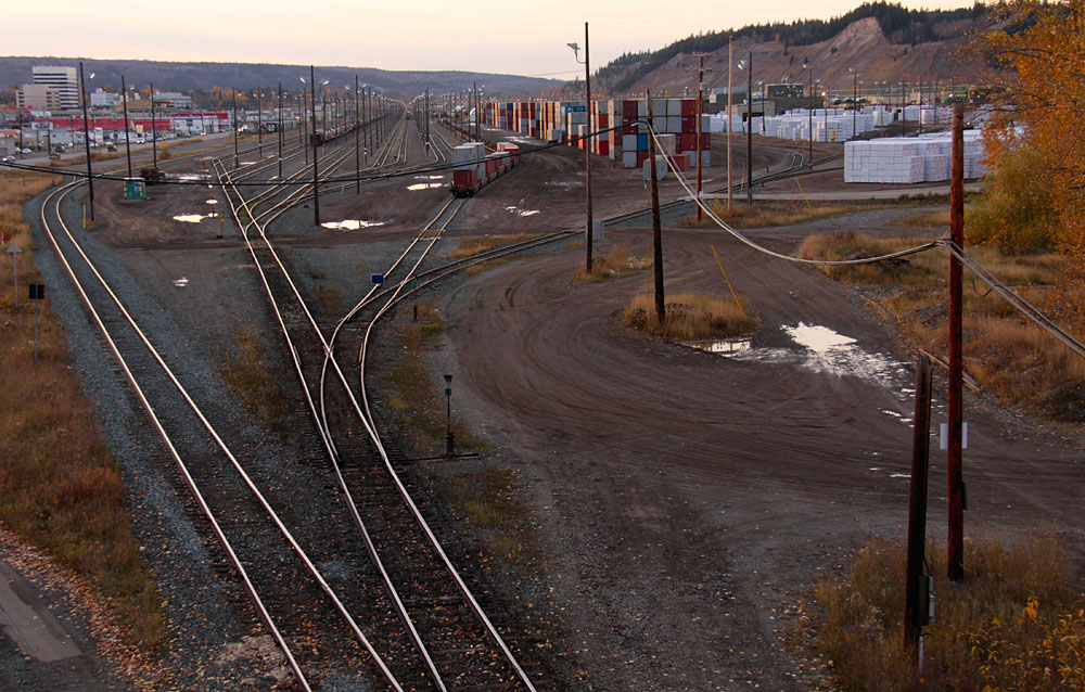 the tracks of the train are close to a mountain