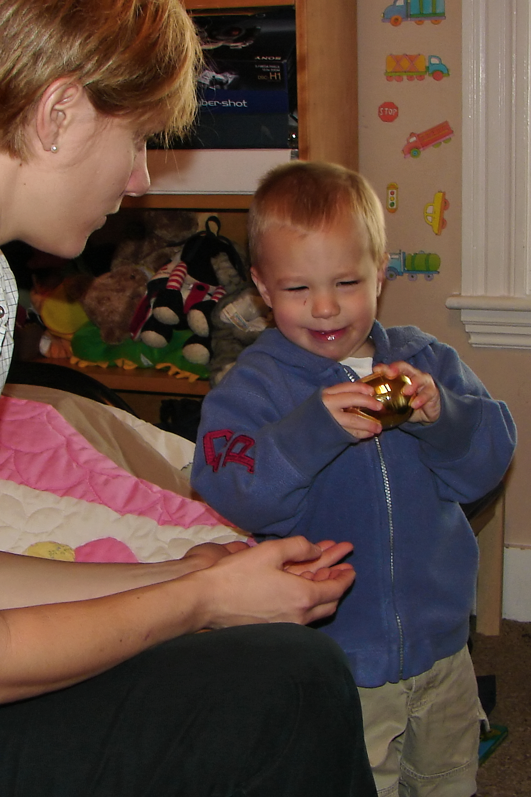 a little boy and his mom eating soing with them