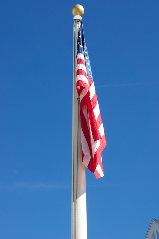 an american flag on the side of a flag pole