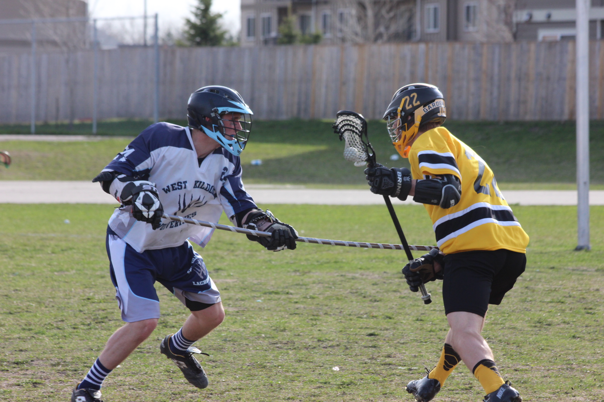 a lacrosse player getting ready to hit the ball