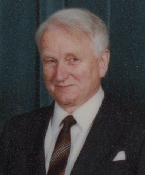 an older man with a nice tie and suit