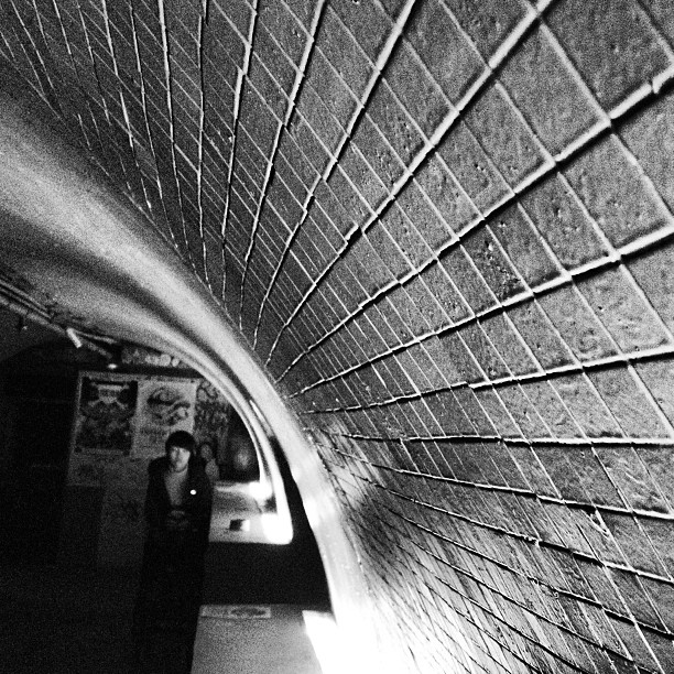 a person standing next to a subway train