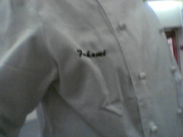 the shirt is white and has the name planter written in it