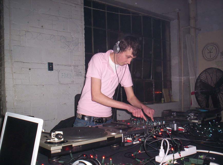 a man is mixing some music in a room