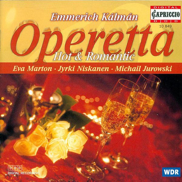 an album cover for the opera with champagne and flowers