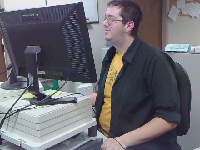 a person standing in front of a computer