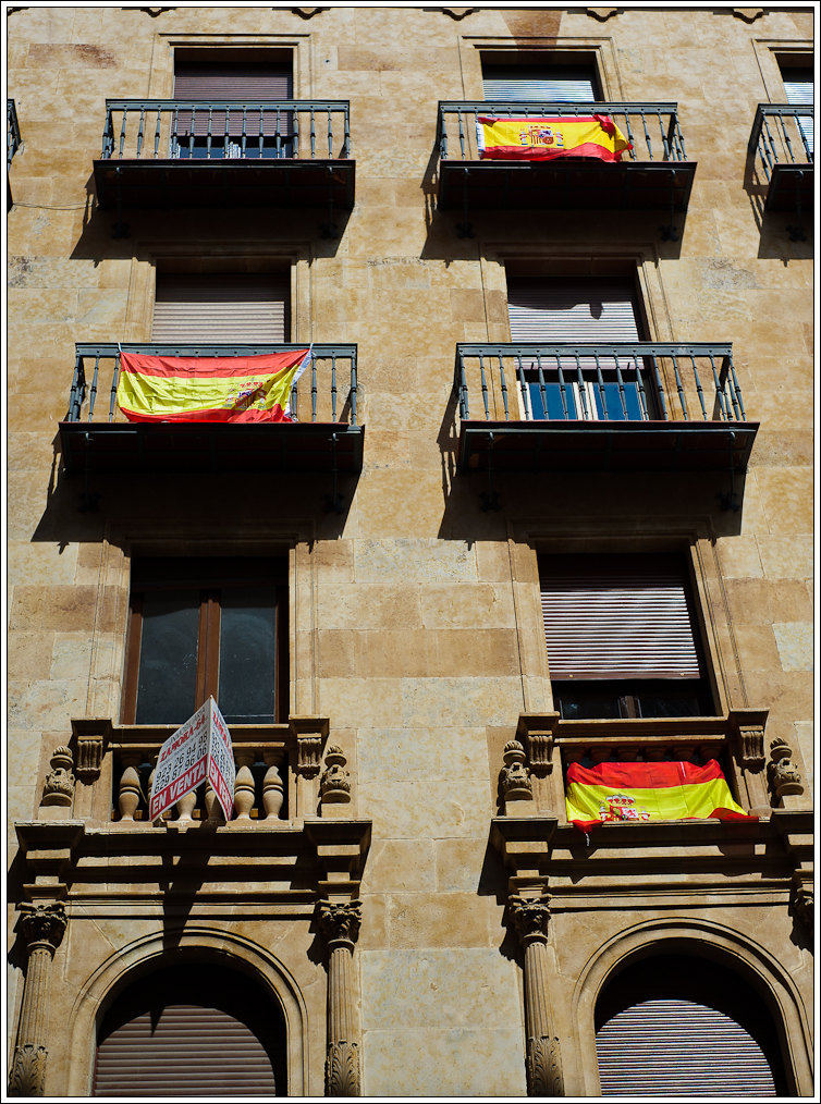 some balconies and some doors on a building