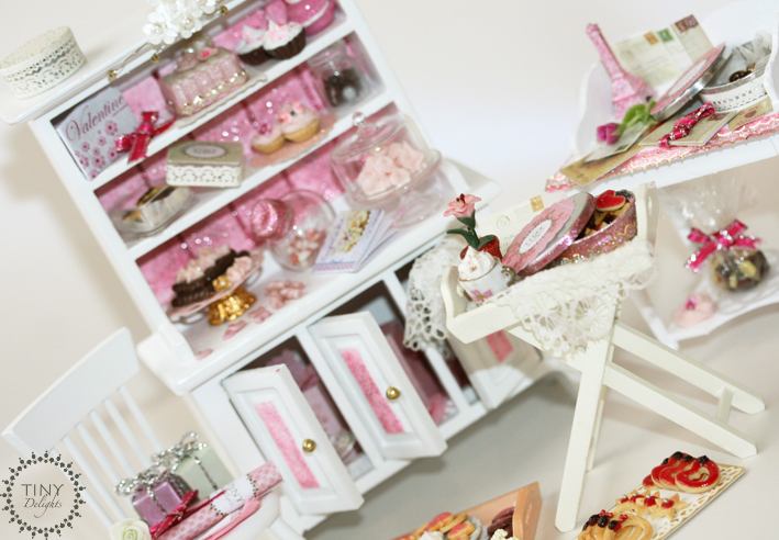 a dollhouse with toys and treats in it