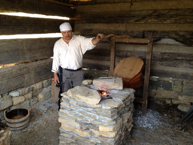 a man is in the barn holding his hand out