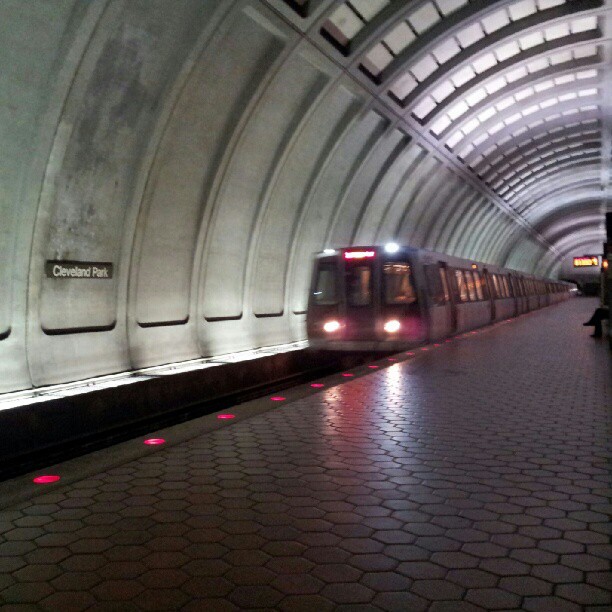 a subway train in a tunnel at night