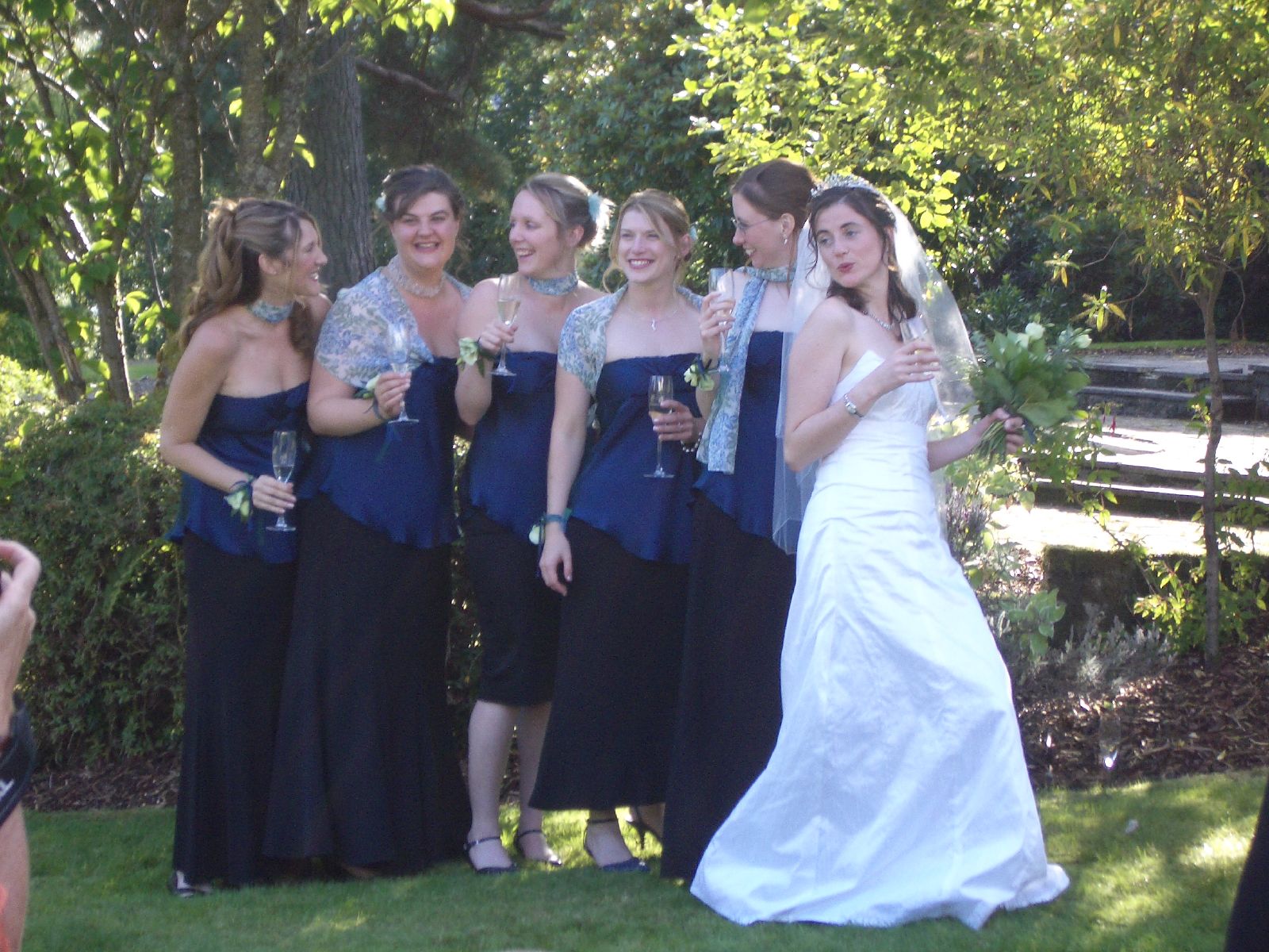 some pretty young women standing in the grass