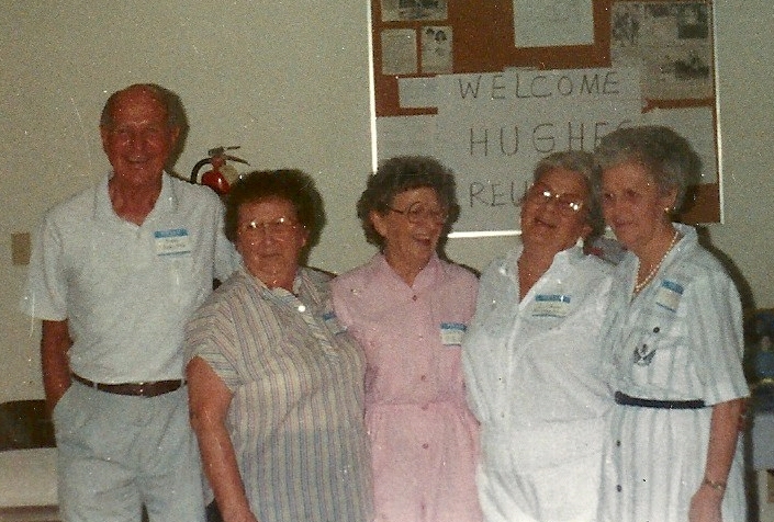 group of elderly women posing for a po